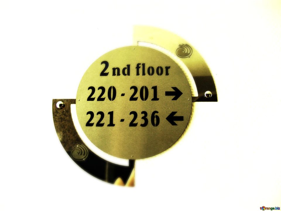 Sign displaying room numbers in a hotel.